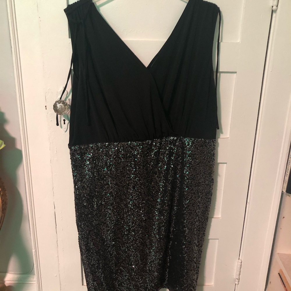 Black jersey top and sequined skirt dress.